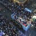 Manchester City celebrate Premier League title win with bus parade and manager Pep Guardiola throws a beer to fans